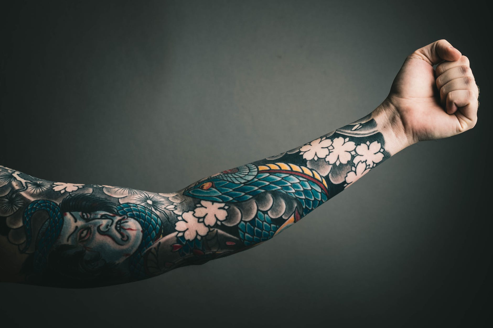 photo of left arm with tattoo
